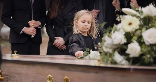 She Held Her Daughter at Her Husband’s Funeral — Then the Little Girl Whispered Something That Stopped the Church Cold
